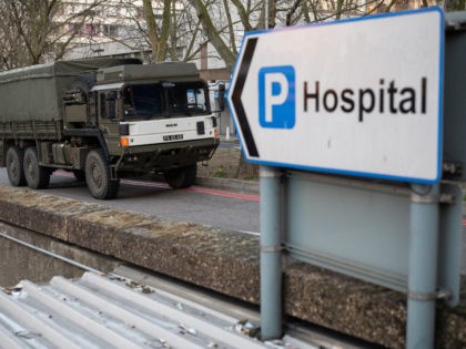 LONDON, UNITED KINGDOM - MARCH 24: A military lorry is seen as members of the 101 Logistic Brigade of the British Army deliver a consignment of medical masks to St Thomas' hospital on March 24, 2020 in London, England. British Prime Minister, Boris Johnson, announced strict lockdown measures urging people …