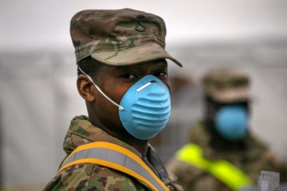 New Yorkers Get Coronavirus Tests At Lehman College In The Bronx NEW YORK, NY - MARCH 28: U.S. National Guard soldiers direct patients at a drive-thru coronavirus testing center at Lehman College on March 28, 2020 in the Bronx, New York City. The center, opened March 23 at Lehman College, can test up to 500 people per day for COVID-19. (Photo …