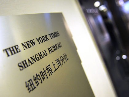 A plaque is seen on the wall outside the New York Times office in Shanghai on October 30, 2012. Lawyers for relatives of Chinese Premier Wen Jiabao have hit back at an "untrue" New York Times article which alleged the family has accumulated vast wealth, a report said. AFP PHOTO/Peter …