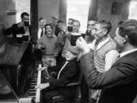 13th October 1963: A group of men from the Atlantic Island of Tristan da Cunha gather for a pint and a sing-song at the local before leaving England. (Photo by Reg Lancaster/Express/Getty Images)