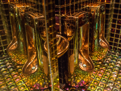 TOKYO, JAPAN - JUNE 29: Gold coloured urinals are seen in the men's bathroom at The Robot Restaurant on June 29, 2014 in Tokyo, Japan. The now famous Robot Restaurant opened two years ago in Kabukicho area of Shinjuku at an estimated cost of 10 million U.S. dollars. Performances are …