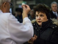 NEW YORK, NY - FEBRUARY 18: A priest serves communion during Mass on Ash Wednesday at St. Patrick's Catherdral on February 18, 2015 in New York City. Ash Wednesday is the holy day that marks the beginning of Lent, a 40-day period in the Christian calendar that leads up to …