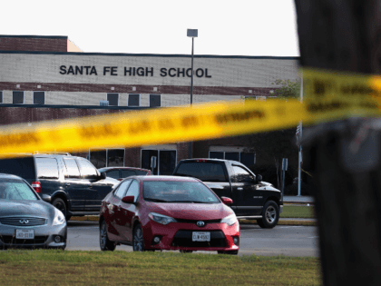 Crime scene tape is stretched across the front of Santa Fe High School on May 19, 2018 in Santa Fe, Texas. Yesterday morning, 17-year-old student Dimitrios Pagourtzis entered the school with a shotgun and a pistol and opened fire, killing at least 10 people. (Photo by Scott Olson/Getty Images)