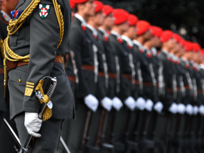 Soldiers of the Austrian guard of honor wait for Russian President Vladimir Putin before a