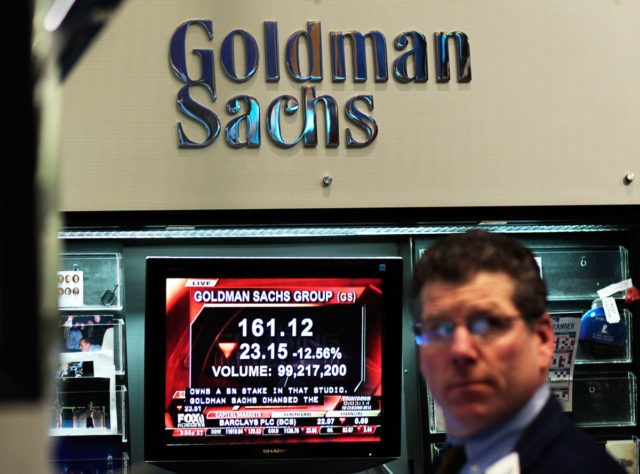 NEW YORK - APRIL 16: A financial professional works in the Goldman Sachs booth on the flo