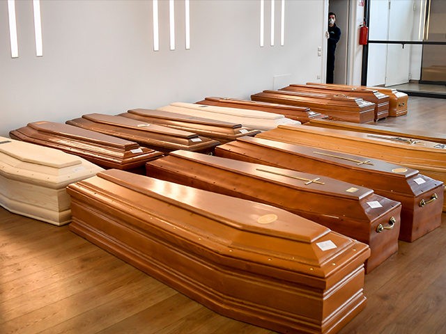 Coffins are lined up on the floor in the Crematorium Temple of Piacenza, Northern Italy, s