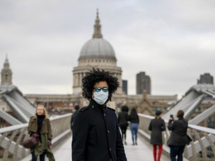 Members of the public wear surgical masks to protect themselves from coronavirus on March 17, 2020 in London, England. The Prime Minister announced the UK is entering the "delay" phase of emergency planning for the Covid-19 crisis. Schools will not be closed at this time although they have been asked …