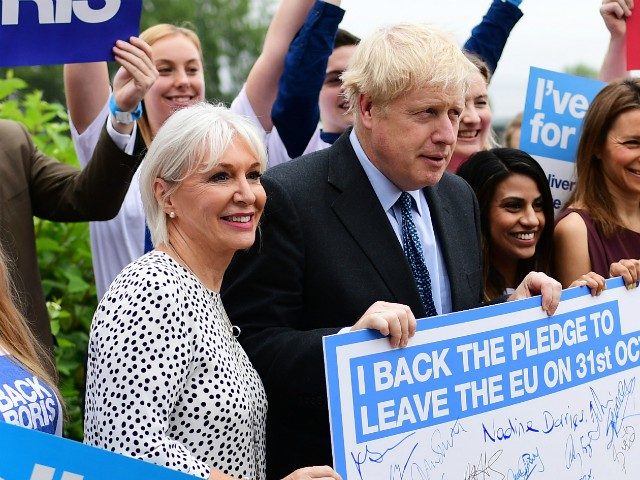 WYBOSTON, ENGLAND - JULY 13: Boris Johnson (C) with Conservative MP Nadine Dorries (left) and supporters before the Conservative leadership hustings on July 13, 2019 in Wyboston, England. Boris Johnson and Jeremy Hunt are the remaining candidates in contention for the Conservative Party Leadership and thus Prime Minister of the …