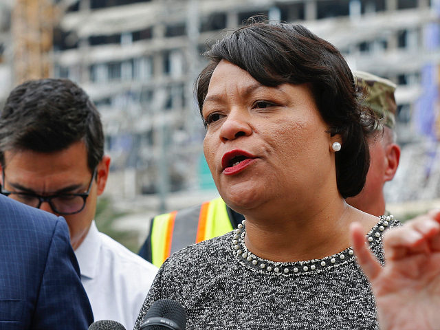 New Orleans Mayor Latoya Cantrell and Louisiana Gov. John Bel Edwards address reporters near the Hard Rock Hotel, Thursday, Oct. 17, 2019, in New Orleans. The 18-story hotel project that was under construction collapsed last Saturday, killing three workers. Two bodies remain in the wreckage. (AP Photo/Gerald Herbert)