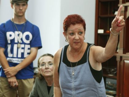 Norma McCorvey, right, the plaintiff in the landmark lawsuit Roe v. Wade, gestures as she speaks up as she joins other anti-abortion demonstrators inside House Speaker Nancy Pelosi's office on Capitol Hill in Washington, Tuesday, July 28, 2009. (AP Photo/Manuel Balce Ceneta)