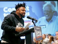 Phillip Agnew gestures as he speaks as a surrogate for Democratic Presidential Candidate Bernie Sanders Friday, Jan.24, 2020, in Iowa City, Iowa. (AP Photo/Sue Ogrocki)