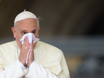 Pope Francis blows his nose on October 9, 2013 as he arrives for his weekly open-air gener