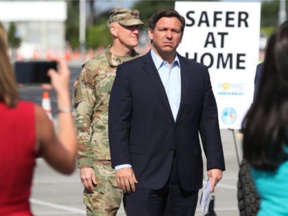 Florida Gov. Ron DeSantis attends a news conference in the Hard Rock Stadium parking lot o