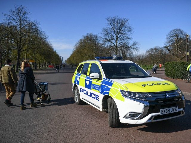 LONDON, ENGLAND - MARCH 22: A Police car is seen parked at the gates to Greenwich Park on March 22, 2020 in London, United Kingdom. British Prime Minister Boris Johnson urged that people don't visit their parents this Mothering Sunday to curb the spread of COVID-19, which has killed 233 …