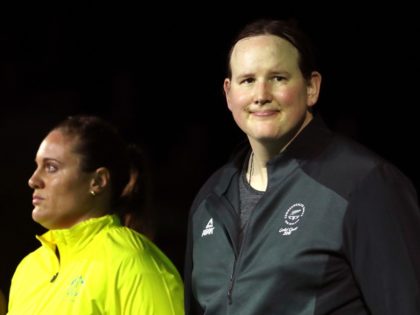 FILE - In this Monday, April 9, 2018 file photo, New Zealand's Laurel Hubbard, right, stands with Australia's Deb Lovely-Acason ahead of the women's +90kg weightlifting final at the 2018 Commonwealth Games on the Gold Coast, Australia. Hubbard was warmly welcomed by many spectators during the games, and was the …
