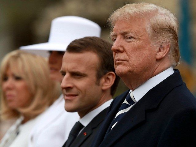 WASHINGTON, DC - APRIL 24: U.S. President Donald Trump (R) and French President Emmanuel Macron (2nd R) listen the national anthem of the United States during a state arrival ceremony at the White House April 24, 2018 in Washington, DC. Macron and Trump are scheduled to meet throughout the day …