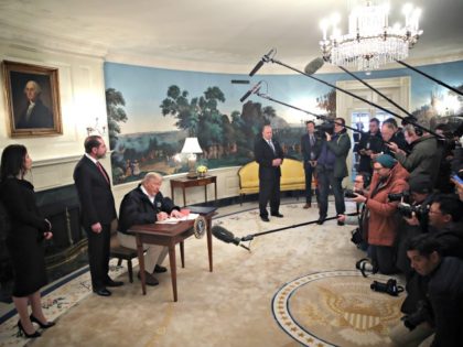 WASHINGTON, DC - MARCH 06: U.S. President Donald Trump, with HHS Secretary Alex Azar, sign