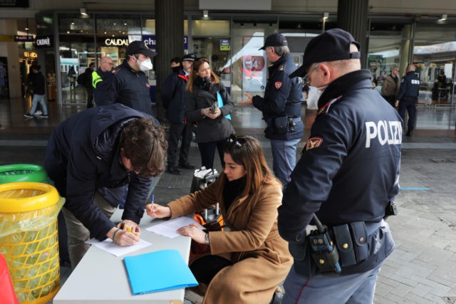 VENICE, ITALY - MARCH 9: Policemen check citizens and tourists at the Venice Santa Lucia railway station, to make sure that they are not violating the quarantine, before they get on the trains to leave the city on March 9, 2020 in Venice, Italy. Prime Minister Giuseppe Conte announced a …
