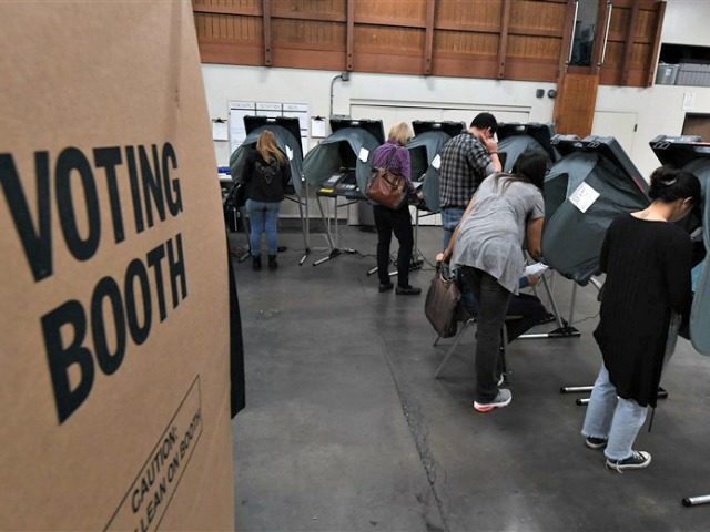 People vote at an Orange County polling station inside a fire station during the midterm elections in Huntington Beach, California, on November 6, 2018.Mark Ralston / AFP - Getty Images
