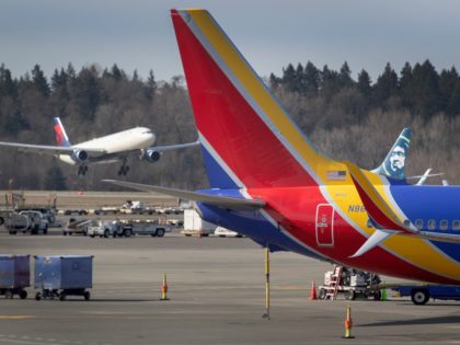 SEATTLE, WA - MARCH 15: A flight lands at the Seattle-Tacoma International Airport on March 15, 2020 in Seattle, Washington. The state of Washington has over 600 confirmed cases of coronavirus (COVID-19) and U.S. airports have been crushed with returning citizens after restrictions on travel from Europe were implemented. (Photo …
