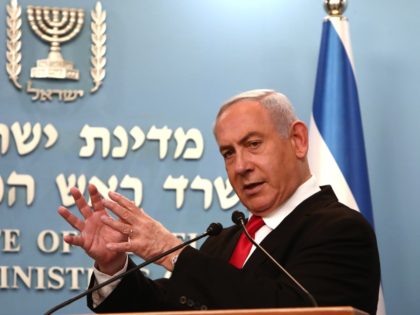 Israeli Prime Minister Benjamin Netanyahu delivers an speech at his Jerusalem office on March 14, 2020, regarding the new measures that will be taken to fight the Corona virus in Israel. - Netanyahu said Israel would shut down eateries, shopping centres and gyms in a bid to halt the spread …