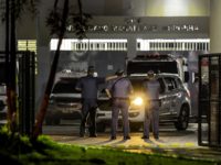 Military police officers are seen at the main entrance of the Doctor Edgar Magalhaes Noronha (Pemano) Penitentiary during a riot on early March 17, 2020, in Tremembe, 155 km from Sao Paulo, Brazil. - Hundreds of prisoners rebelled and fled from various jails in the interior of Sao Paulo on …
