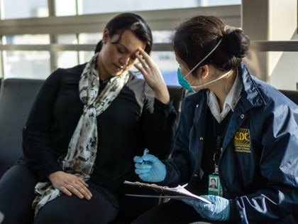 Centers for Disease Control and Prevention (CDC), Quarantine Station staff, respond to reports of sick travelers at 18 United States international airports, and land ports of entry, where most international travelers arrive. Here, CDC Quarantine, Public Health Officer, Diana Lu, was assessing a sick traveler, who had just arrived at …