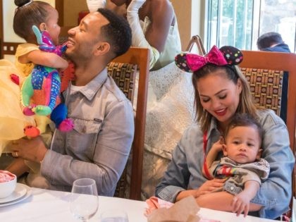 ANAHEIM, CALIFORNIA - APRIL 12: In this handout image, John Legend, Chrissy Teigen, their daughter Luna and son Miles share a moment with Princess Tiana during the Disney Princess Breakfast Adventures at Disney's Grand Californian Hotel on April 12, 2019 in Anaheim, California. (Photo by Joshua Sudock/Disneyland Resort via Getty …