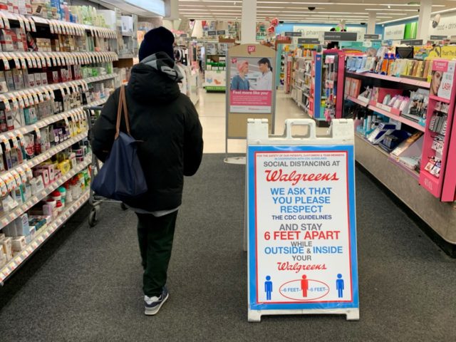 CAMBRIDGE, MASSACHUSETTS - MARCH 23: Walgreens display social distancing guidelines at the