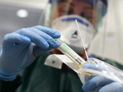 Nurse Canan Emcan shows a test kit for coronavirus samples at the isolation ward of the Uniklinikum Essen university hospital in Essen, western Germany, on March 9, 2020. - The number of coronavirus cases in Germany has passed 1,000, official data from the Robert Koch Institute disease control centre showed. …