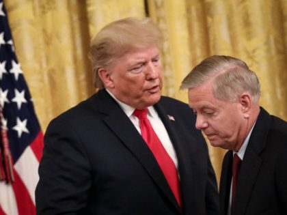 WASHINGTON, DC - NOVEMBER 6: (L-R) President Donald Trump speaks to Sen. Lindsey Graham (R-SC) during an event about judicial confirmations in the East Room of the White House on November 6, 2019 in Washington, DC. More than 150 of the president's federal judicial nominees have been confirmed by the …
