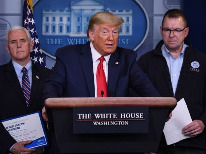 US President Donald Trump, flanked by FEMA Administrator Peter Gaynor (R) and US Vice President Mike Pence, speaks during the daily briefing on the novel coronavirus, COVID-19, at the White House on March 22, 2020, in Washington, DC. (Photo by Eric BARADAT / AFP) (Photo by ERIC BARADAT/AFP via Getty …