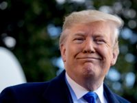 President Donald Trump smiles while speaking to reporters on the South Lawn of the White House in Washington, Friday, Nov. 8, 2019, before boarding Marine One for a short trip to Andrews Air Force Base, Md. and then on to Georgia to meet with supporters. (AP Photo/Andrew Harnik)