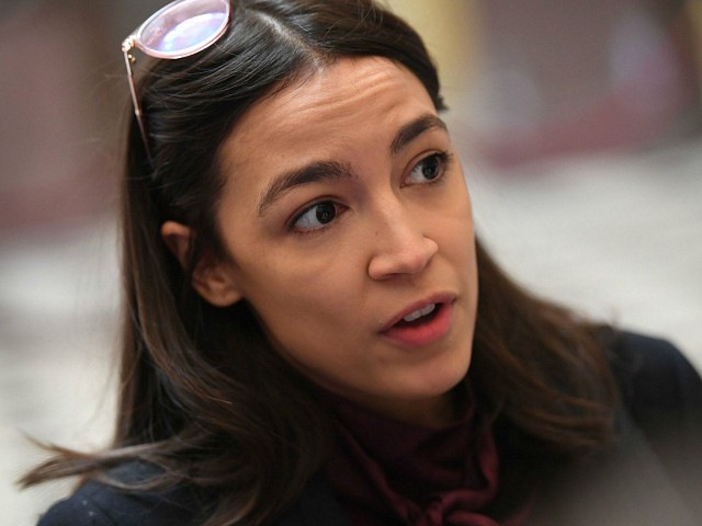 Rep. Alexandria Ocasio-Cortez(D-NY) talks with reporters at the US Capitol, as the House readies for a historic vote on December 18, 2019 in Washington, DC. - President Donald Trump faces becoming only the third US leader ever to be impeached on December 18, 2019 with the House of Representatives set for a historic vote that would trigger his trial in the Senate.On the morning of the vote, Trump once again insisted that he had done "nothing wrong," following the release of a letter in which he likened the proceedings to an "attempted coup" and a witch trial. (Photo by Saul LOEB / AFP) (Photo by SAUL LOEB/AFP via Getty Images)