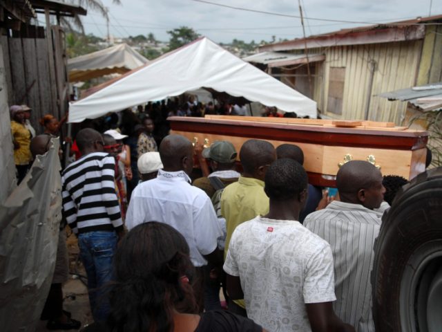 Some of 150 people take part on August 22, 2012 to the funeral of a woman who died during