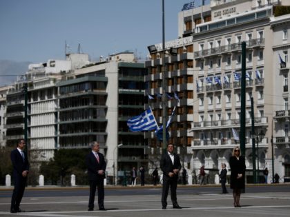 Greek Prime Minister Kyriakos Mitsotakis (L) and Greek former Prime Minister and leader of the main opposition Syriza party Alexis Tsipras (3rd L) with leaders of other parties attend a ceremony marking Greece's Independence Day, at the Tomb of the Unknown Soldier at central Syntagma Square in Athens, on 25 …