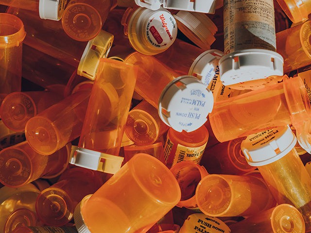 Pile of empty medicine bottles.