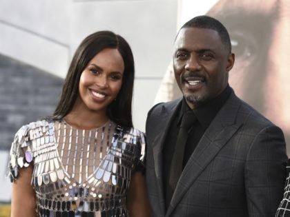 Cast member Idris Elba, center, arrives with his wife Sabrina Dhowre Elba, left, and Isan Elba, right, at the Los Angeles premiere of "Fast & Furious Presents: Hobbs & Shaw" on Saturday, July 13, 2019, at the Dolby Theatre. (Photo by Jordan Strauss/Invision/AP)