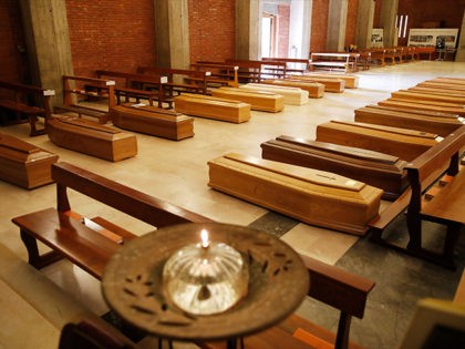 Coffins are lined up on the floor in the San Giuseppe church in Seriate, one of the areas