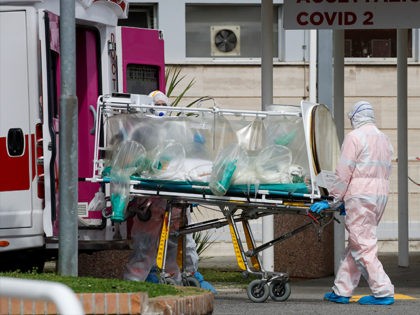 A patient in a biocontainment unit is carried from an ambulance arrived at the Columbus Co