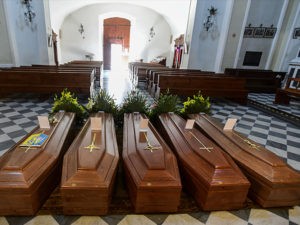 This picture taken on March 21, 2020 shows coffins on the ground of the church in Serina, near Bergamo, northern Italy.(Piero Cruciatti/AFP via Getty Images)