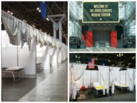 Members of the Army National Guard walk through the Jacob K. Javits Center on March 27, 2020 in New York. - The New York National Guard, the US Army Corps of Engineers, and Javits employees are constructing a 1,000-bed facility at the center, as the state tries to contain the …