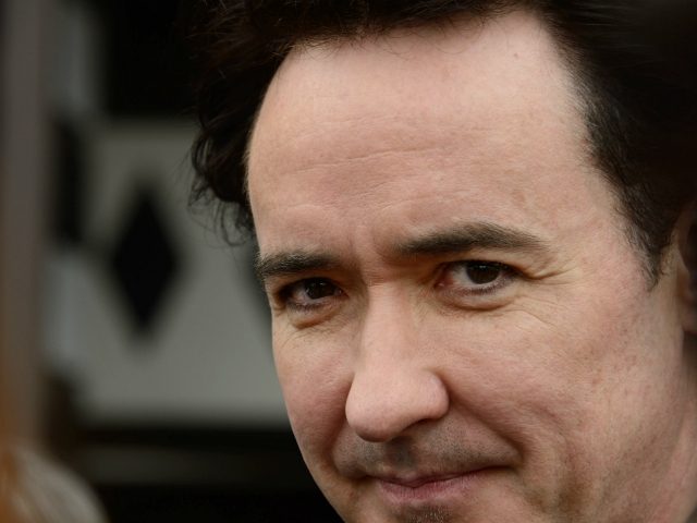 Actor John Cusack receives a star on the Hollywood Walk of Fame in Hollywood, California on April 24, 2012. The ceremony comes three days before the release of Cusack's latest film, ``The Raven.'' AFP PHOTO/ROBYN BECK (Photo credit should read ROBYN BECK/AFP via Getty Images)