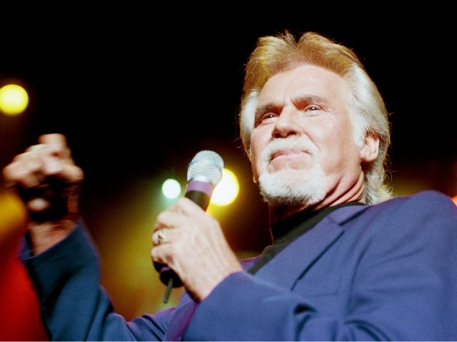 Country music star Kenny Rogers perfoms at a concert in Warsaw, Tuesday, April 27, 1999. With the Warsaw concert Rogers began his European Tour 1999. (AP Photo/Alik Keplicz)
