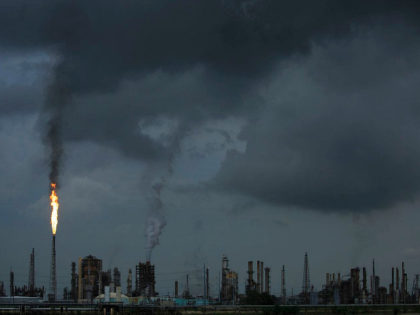 NORCO, LA - AUGUST 21: A gas flare from the Shell Chemical LP petroleum refinery illuminat