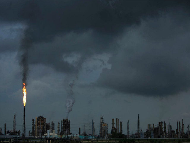 NORCO, LA - AUGUST 21: A gas flare from the Shell Chemical LP petroleum refinery illuminates the sky on August 21, 2019 in Norco, Louisiana. Located about 10 miles up the Mississippi River from New Orleans, the plant agreed to install $10 million in pollution monitoring and control equipment in …