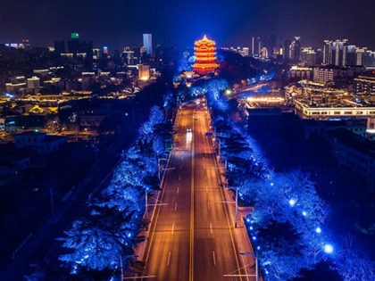 This aerial photo taken on March 16, 2020 shows a view of an empty road at night in Wuhan