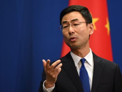 Chinese Foreign Ministry spokesman Geng Shuang speaks during the daily press briefing in Beijing on March 18, 2020. - China on March 18 announced it would expel American journalists from three major US newspapers in one of the communist government's biggest crackdowns on the foreign press, escalating a bitter row …