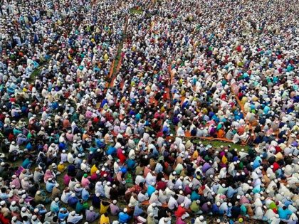 TOPSHOT - Thousands of Muslims attend a prayer session asking for safety amid concerns over the spread of the COVID-19 novel coronavirus, near Raipur in Lakshmipur district on March 18, 2020. - Thousands of Muslims have joined a special prayer in a southern Bangladesh town seeking protection from the coronavirus …