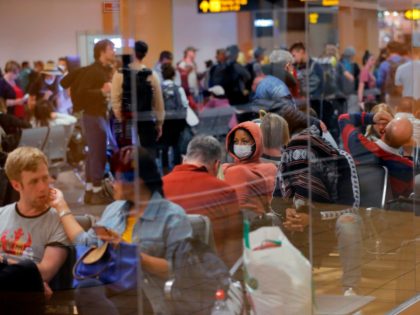 Travellers await for their flights out of Peru on March 16, 2020 at the Jorge Chavez international airport in Callao, Lima, minutes before borders are closed. - On March 15, 2020, President Martin Vizcarra announced a State of Emergency and a two-week nationwide home-stay curfew together with the closure of …